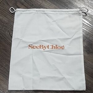 See By Chloé white dust bag with rose gold logo